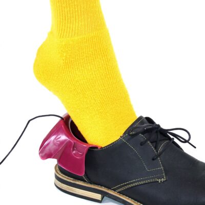 A foot slipping into a shoe utilizing The Funnel® for the foot by Insightful products