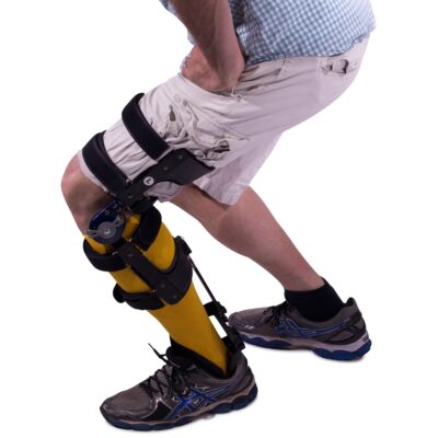 A masted knee brace from Insightful Products being worn by a person in action