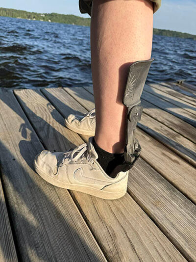 A view from behind of a person wearing the Strapless Step Smart Brace