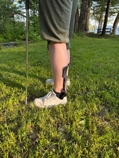 A view from the side of a person wearing the Strapless Step Smart Brace